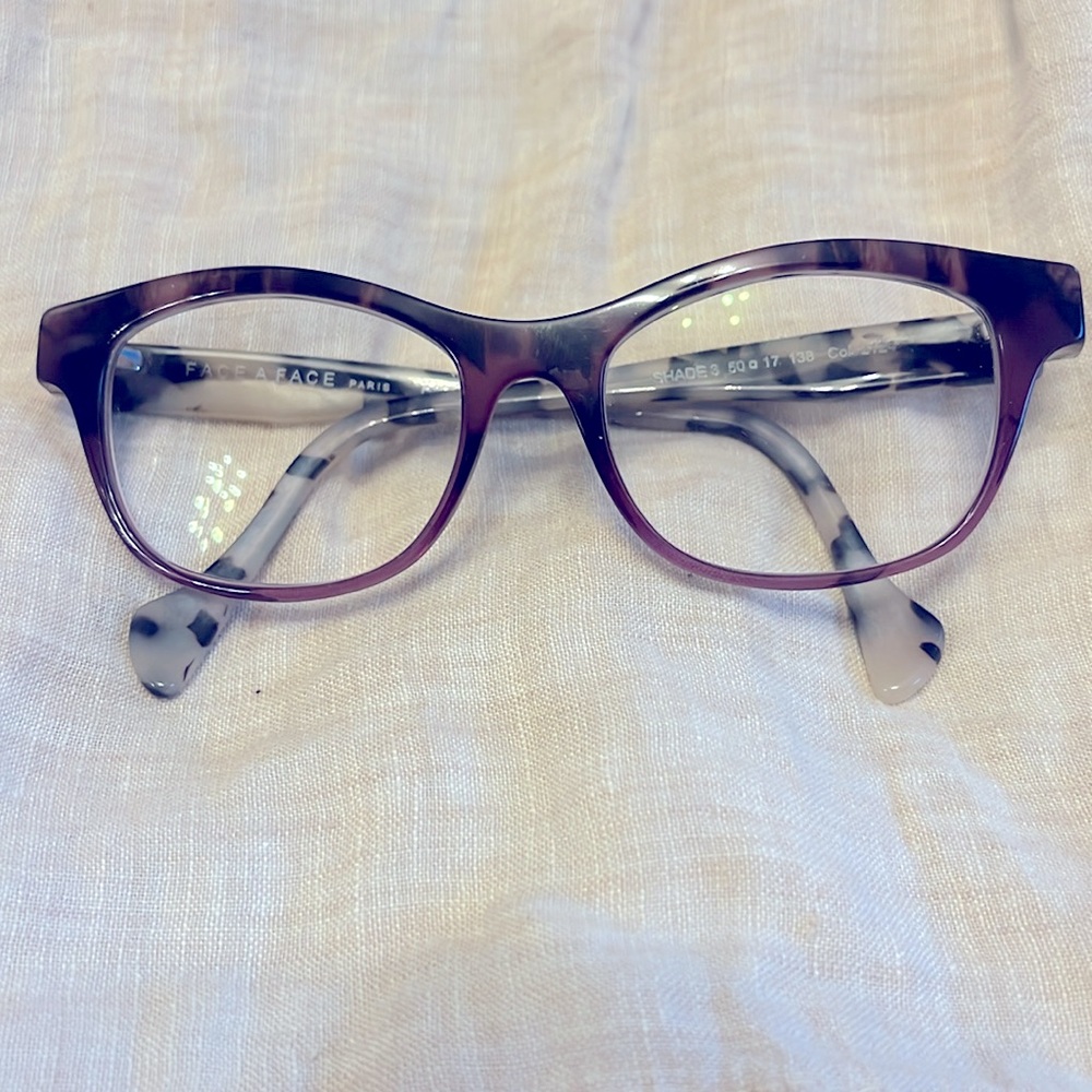 Face a Face frame. Purple with charcoalal/brown/tan temples.  Rx lenses.